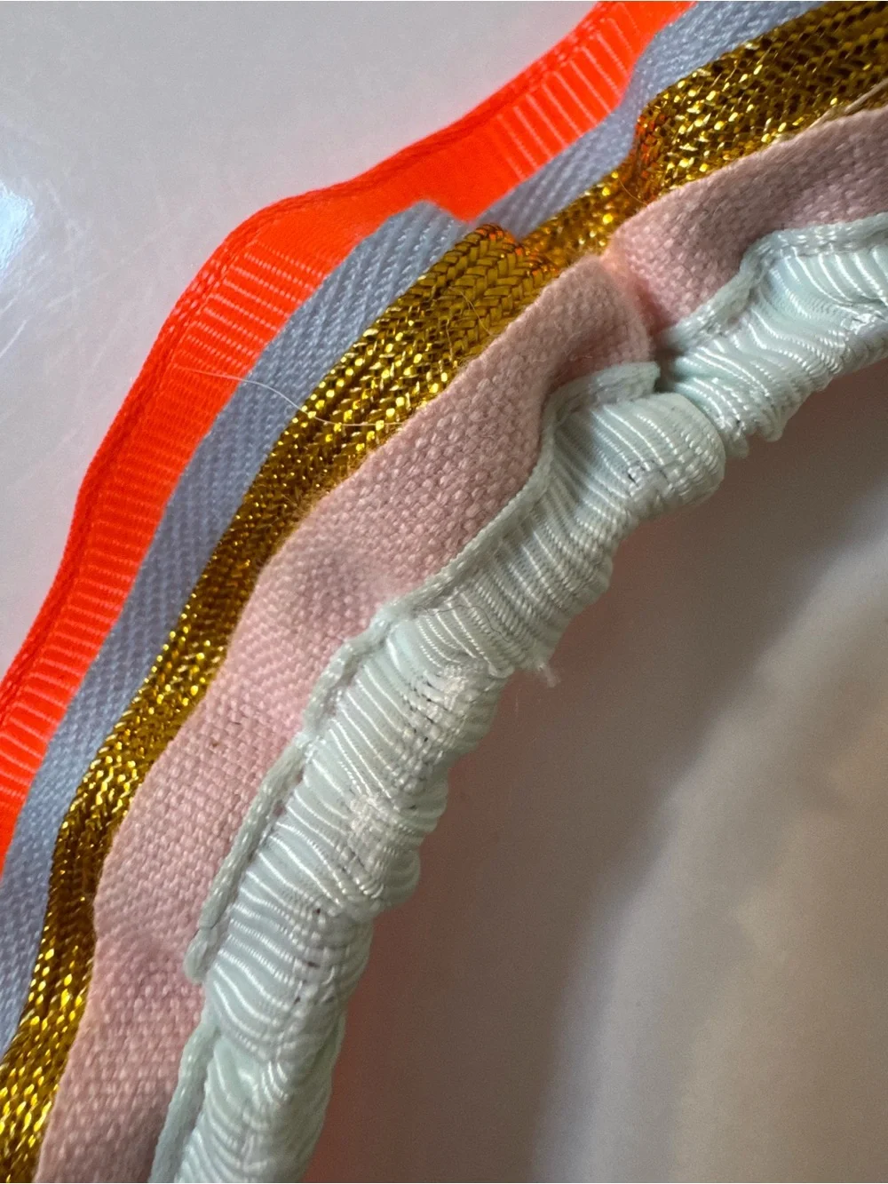 Meri Meri Neon Orange Trim Multicolor Ruffled Headband with metallic gold trim